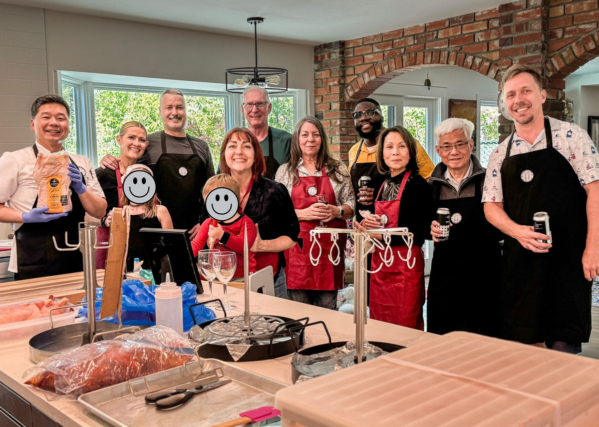 Chef Philip with guests at a private in-home Peking duck cooking experience.