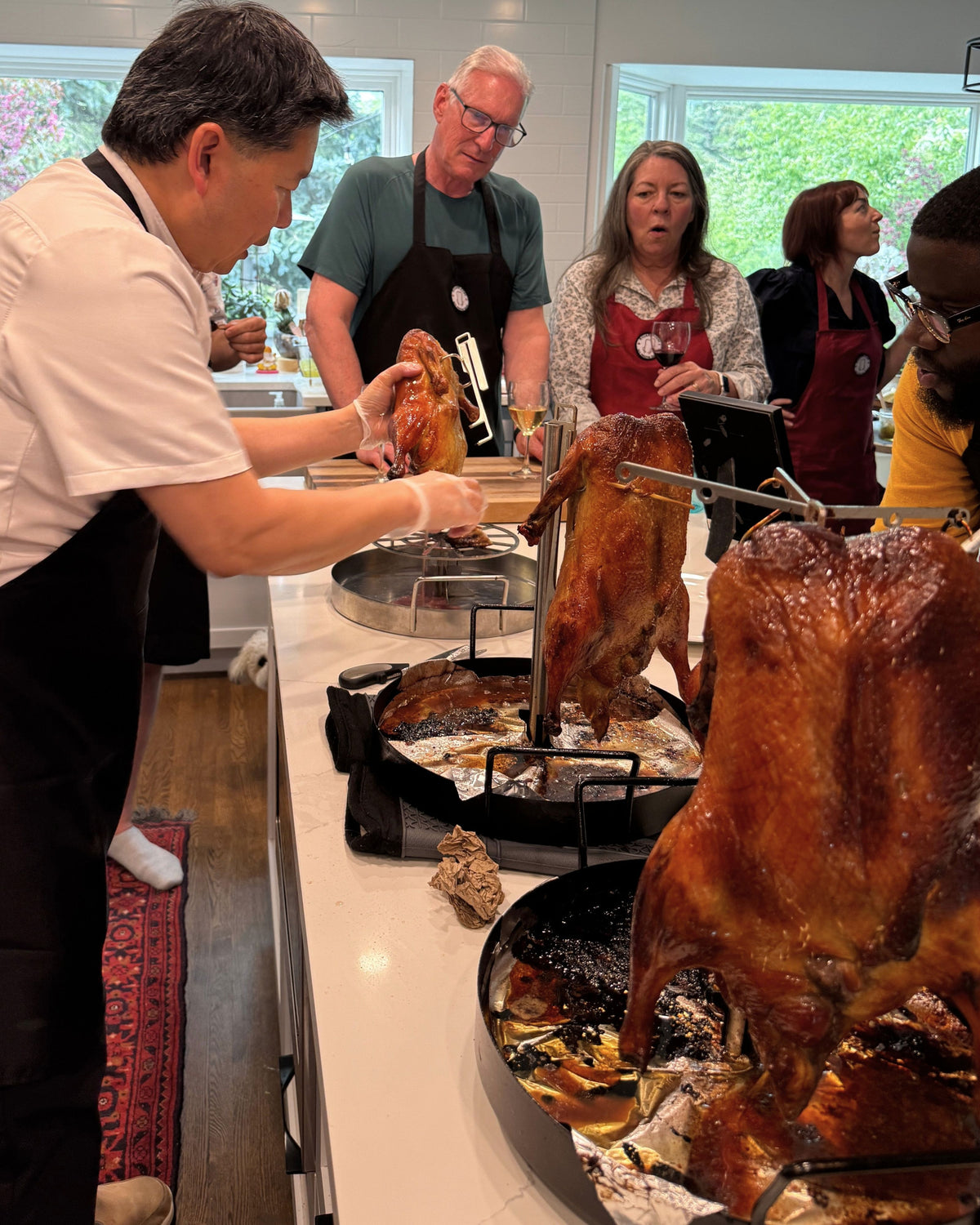 UpRoaster whole Peking ducks with crispy golden skin, no-fail guaranteed, roasted in a student's home kitchen during an in-home cooking class.